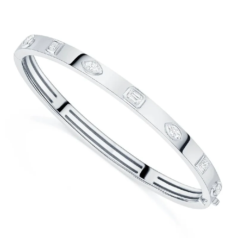 Women’s twisted bangles-18ct White Gold Seven Stone Fancy Cut Diamond Rubover Set Bangle