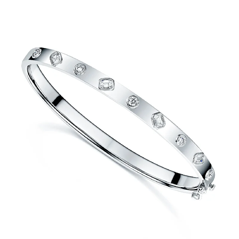 Women’s engraved bangles-18ct White Gold Emerald Cut And Round Brilliant Cut Diamond Bangle