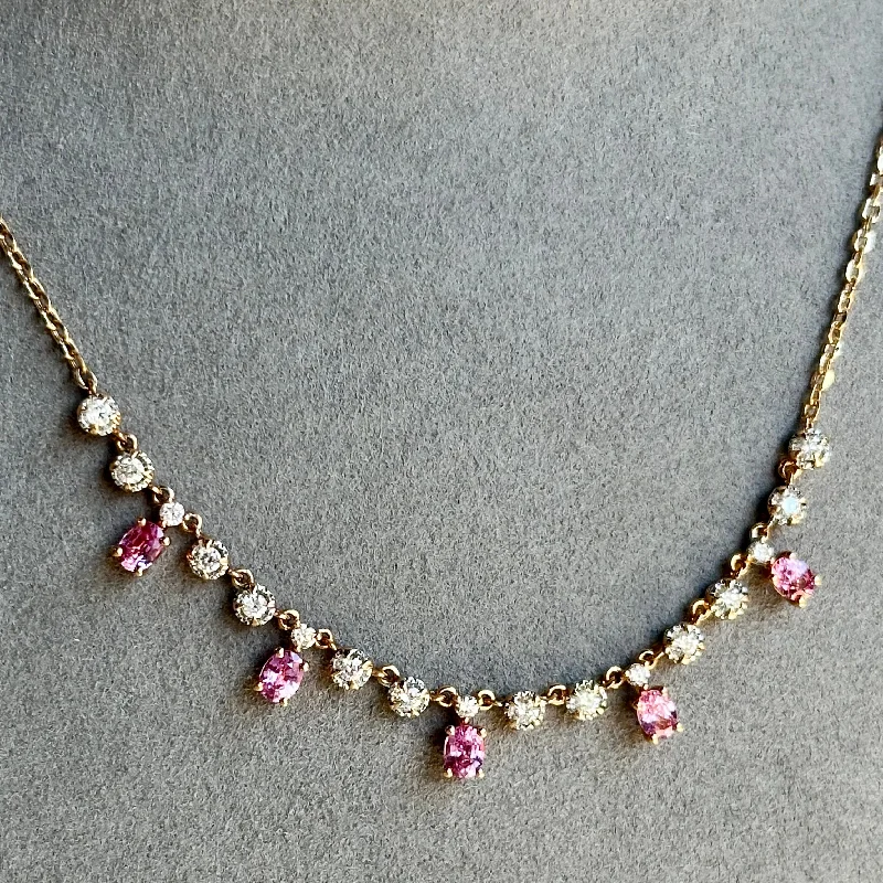 Women’s gemstone heart necklaces-18kt Rose Gold Oval Cut Pink Sapphire Necklace with Round Cut Diamonds