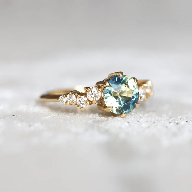 Women’s vintage-inspired engagement rings-Round bicolor sapphire and diamond cluster ring